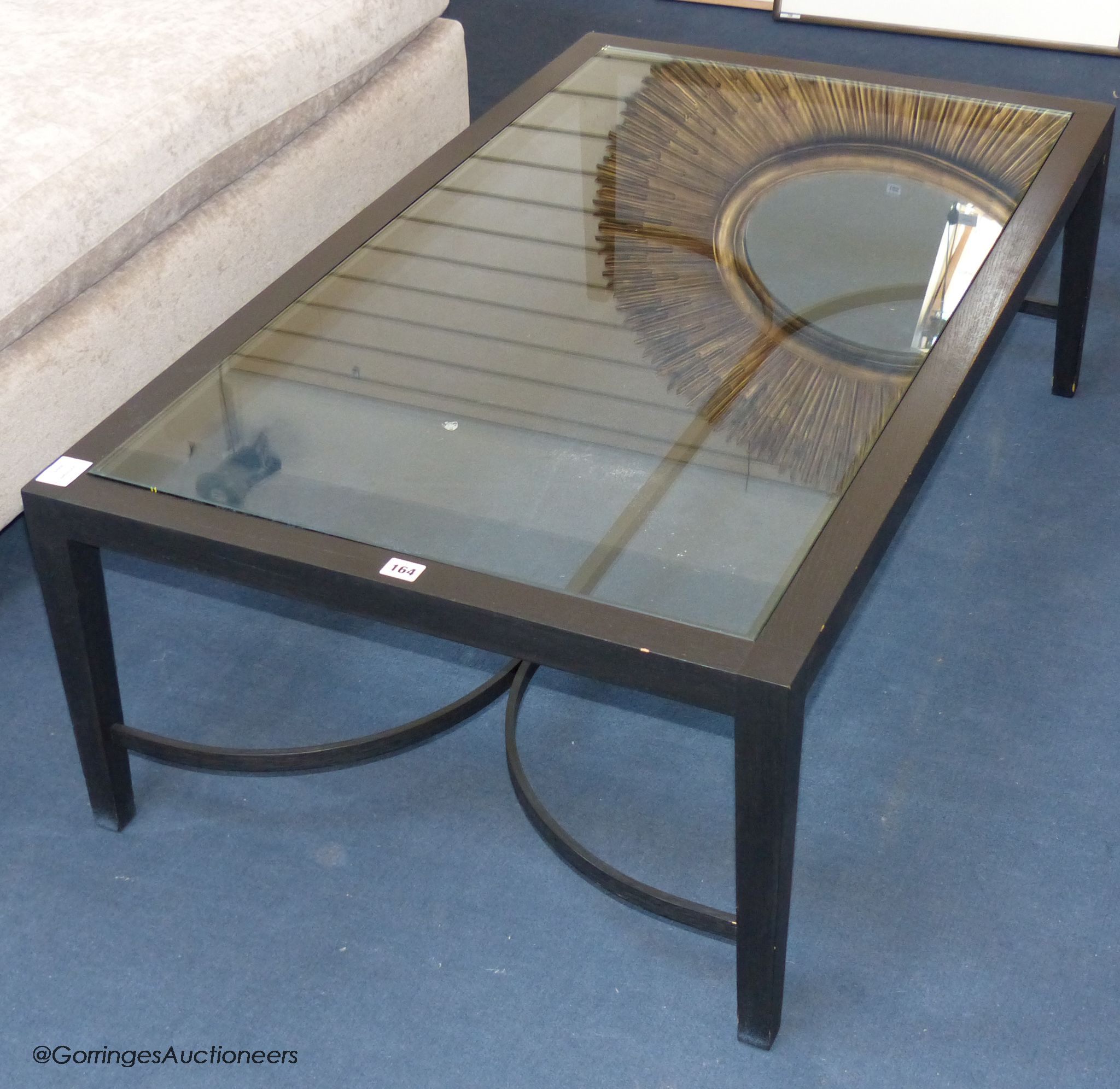 An ebonised ash and glass coffee table, 120 cm long, 70 cm deep, 40 cm high